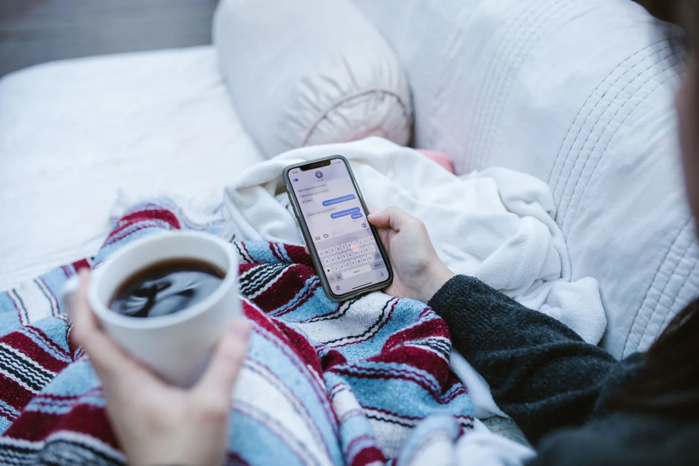 A person on a smartphone composing a WhatsApp message with a link ready to share