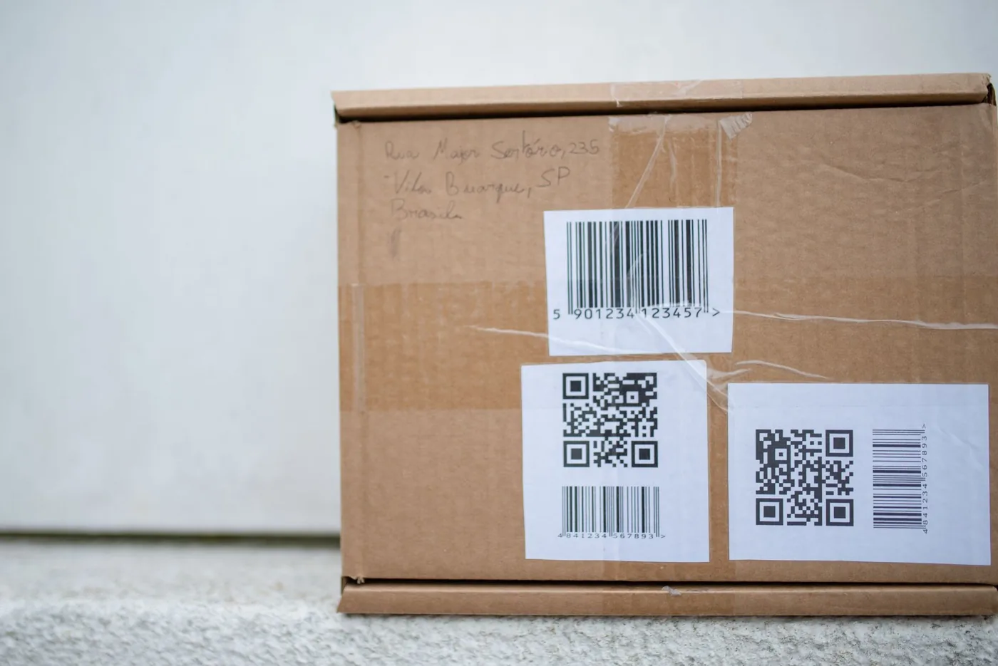 A product box with a clearly visible QR code label printed on a white background panel